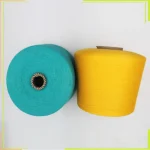 top view of antibacterial moisturizing sock yarn cones in turquoise and yellow
