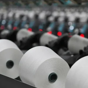 White quick-drying yarn cones on the VI-TEX production line