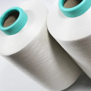 Self-Cleaning Copper Blend Yarn (1) Angled view of copper self-cleaning yarn cones for sock mills