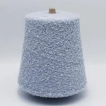 Light blue 13s soft loop wool blend yarn cone, front view for knitting use