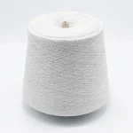 White viscose nylon boucle yarn cone in 70/30 blend for soft, skin-friendly knitwear
