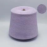 Light purple viscose nylon boucle yarn cone with close-up loop texture and soft hand feel