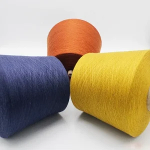 Color spun cotton sock yarn cones in blue yellow and orange
