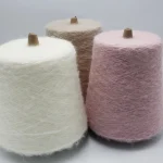 Heat generating brushed yarn color options in white beige and pink cone yarn