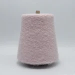 Pink heat generating brushed yarn cone for colorful socks and knitwear