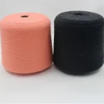2/45 merino wool blend yarn cones in pink and black side by side