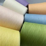 Silk linen blend dyed yarn cones in multiple colors for custom knitting orders