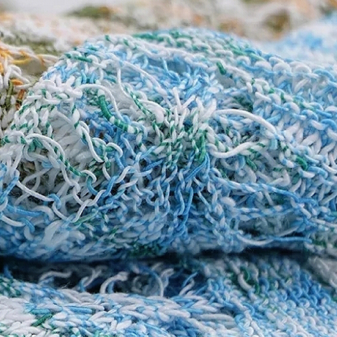 Close-up texture of regenerated cellulose blended yarn in blue and white tones