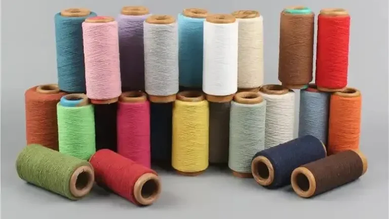 Colored yarn cones used in yarn dyeing for textile production
