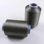 Two cones of PVD copper coated yarn for sock production