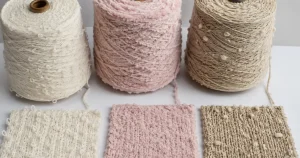 Loop yarn, chenille yarn and big slub yarn cones with knitted swatches